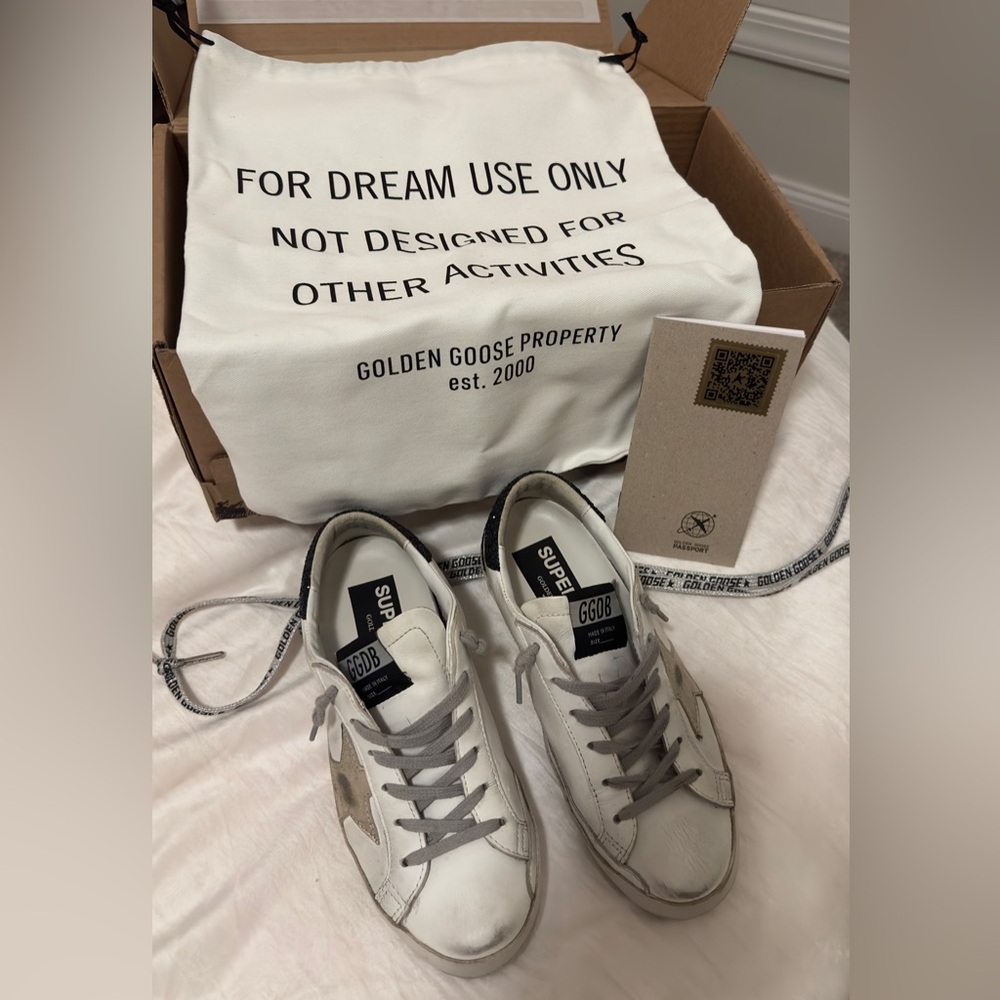 Golden Goose Super-Star with gold star and black glitter heel tab